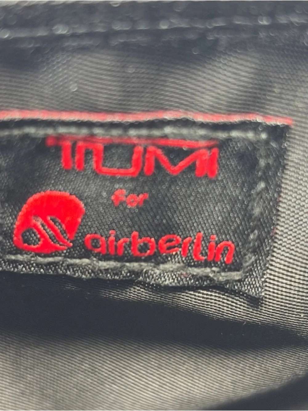 Tumi Black Textile Toiletry Pouch with Red AirBerlin Logo Accent